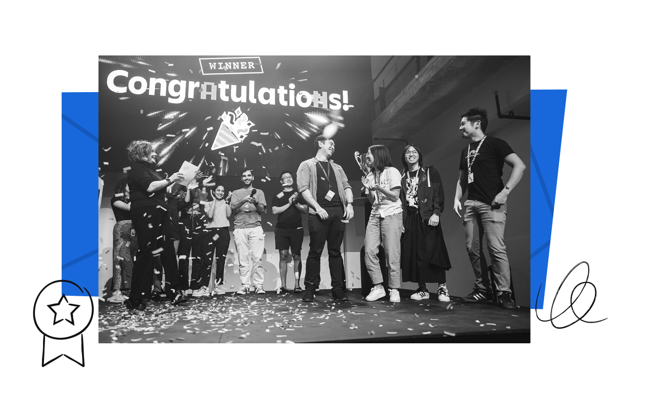 A picture of the winners of Atlassian's ShipIt hackathon accepting the award.